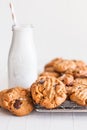 Fresh baked cookies on a cooling rack near an old fashioned milk bottle Royalty Free Stock Photo