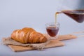 Fresh baked croissant with coffee ,  tasty breakfast Royalty Free Stock Photo