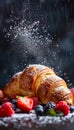 Fresh Baked Croissant with Raindrops, Berries and Powdered Sugar Against a Dark Moody Background Royalty Free Stock Photo