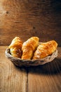 Fresh baked croissant sprinkled with powdered sugar