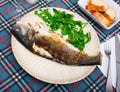 Fresh baked fish sea bass with arugula