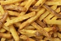 Fresh baked French peel potato fries full frame as background