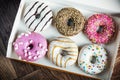 Fresh baked glazed donuts in a box