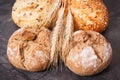 Fresh baked homemade wholegrain rolls or bread with seeds and ears of grain Royalty Free Stock Photo