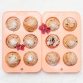 Fresh baked muffins or cupcakes in pink silicone baking tins Royalty Free Stock Photo