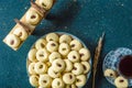 Fresh baked nut biscuits on grid next to cup of tea Royalty Free Stock Photo