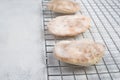 Fresh baked pita bread on a colling grid, empty copy space for text Royalty Free Stock Photo