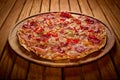 Fresh Baked Pizza on Wooden table Royalty Free Stock Photo