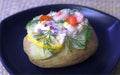 Classic baked potato with shrimps, red onion, dill, lemon and tomato.