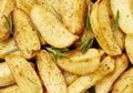 Fresh baked potato wedges with rosemary Royalty Free Stock Photo