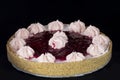 Fresh baked raspberry pie with whipped cream decorations on top Royalty Free Stock Photo