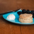 Fresh Baked Scone With Cream and Berry Jam