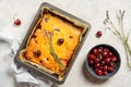 Fresh baked sweet cherry pie or red brownie cake in baking sheet with lavender, napkin and raw berries aside. Royalty Free Stock Photo