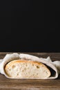 Fresh baked white bread slice slice on a dark background. Front view copy space. Royalty Free Stock Photo