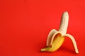 Fresh banana on red background. Sex concept