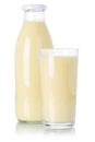 Fresh banana smoothie fruit juice drink milkshake milk shake in a bottle and glass isolated on white Royalty Free Stock Photo