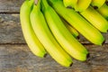 Fresh bananas a bunch on wooden background Royalty Free Stock Photo