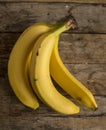 Fresh bananas on wooden background Royalty Free Stock Photo