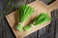 Fresh barley grass blades on a wooden cutting board Royalty Free Stock Photo