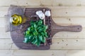 Fresh Basil, Olive Oil, and Garlic on Rustic Board Royalty Free Stock Photo