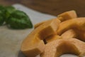 fresh basil placed next to sliced canaloupe on a countertop