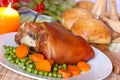 Fresh Bavarian roasted knuckle of pork with carrot Royalty Free Stock Photo