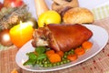 Fresh Bavarian roasted knuckle of pork with carrot Royalty Free Stock Photo