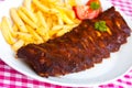 Fresh BBQ, marinated spareribs and fries Royalty Free Stock Photo