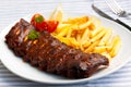 Fresh BBQ, marinated spareribs and fries Royalty Free Stock Photo