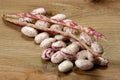 Fresh raw beans on a wooden table