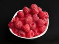 Fresh beautiful raspberries in a white bowl Royalty Free Stock Photo