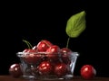 Fresh beautiful red cherries in a glass bowl