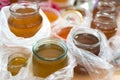 Fresh bee honey, dark brown and light golden, in containers and glass jar