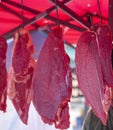 Fresh beef hanging on an iron for sale Royalty Free Stock Photo