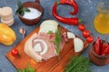 Fresh beef and pork steak with ingredients for cooking on the old table, raw meat with dill, parsley, salt on a cutting wooden