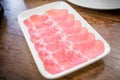 Fresh beef raw sliced was served for Sukiyaki and Shabu or Yakiniku   restaurant which it put on white plate Royalty Free Stock Photo