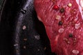 Fresh Beef for Steak New York Sprinkled Served with Mix Pappercorns, Large Crystals of Himalayan Pink Salt, Smoked Brown Salt Crys Royalty Free Stock Photo