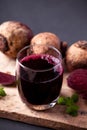 Fresh beetroot juice in glass on wooden with black background Royalty Free Stock Photo