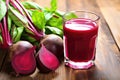 fresh beetroots next to a glass of juice