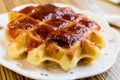 Fresh Belgian liege waffle with strawberry jam Royalty Free Stock Photo