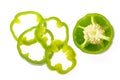 Fresh bell pepper with sliced parts isolated on white background