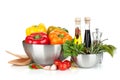 Fresh bell peppers and herbs in bowls