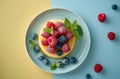 Fresh berries on a creamy dessert on a pastel background