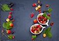 Fresh Berries on Slate Background (Strawberries, Raspberries and