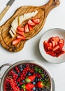 Fresh berries, sliced strawberry and banana. Royalty Free Stock Photo
