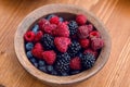 Fresh berries , strawberries, raspberries, blueberries in a copper bowl Royalty Free Stock Photo