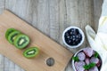 Fresh berries: strawberry, kiwi and blueberry on white background from side view. Royalty Free Stock Photo