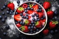 fresh berries with yogurt and granola in a bowl on a black table. symbolize healthy eating, balance Royalty Free Stock Photo