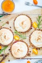 Fresh Berry Tartlets filled with Lemon Curd, Kumquat Jam, Berries and Meringue, Delicious Dessert Royalty Free Stock Photo