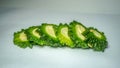 Fresh bitter melon on white. Healthy bitter melon for human body. sliced cucumber on white background.